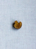 Picoti hen on nest button