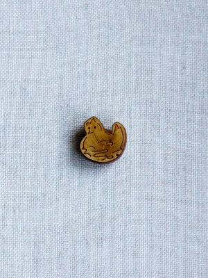 Picoti hen on nest button