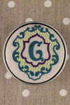 "G" stamped on linen