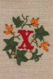 "X"  stamped on linen